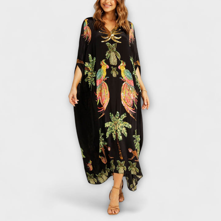 Robe accrocheuse aux épaules asymétriques et motif de cocotiers