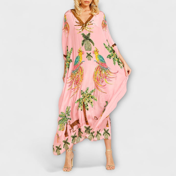 Robe accrocheuse aux épaules asymétriques et motif de cocotiers