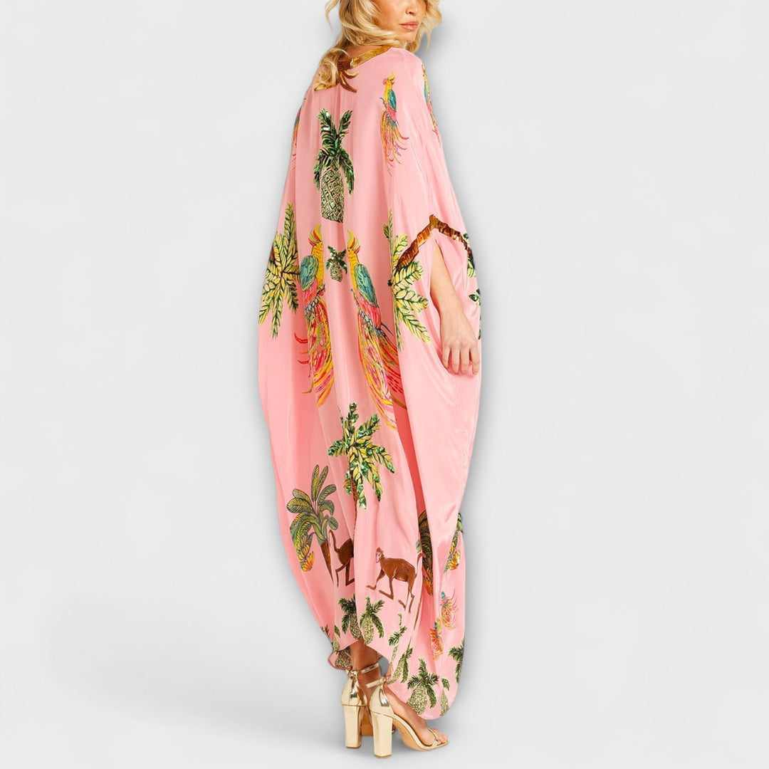 Robe accrocheuse aux épaules asymétriques et motif de cocotiers