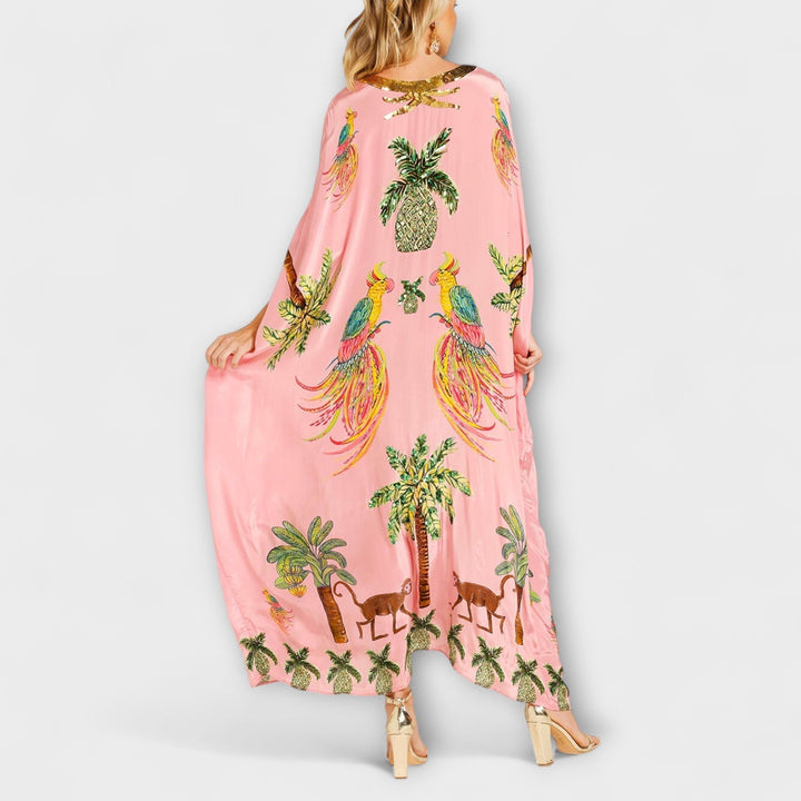 Robe accrocheuse aux épaules asymétriques et motif de cocotiers