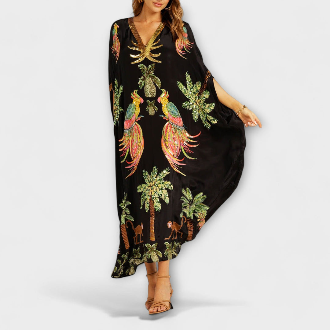 Robe accrocheuse aux épaules asymétriques et motif de cocotiers