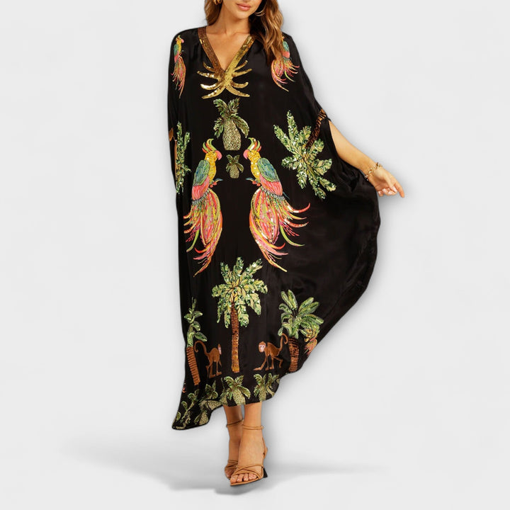 Robe accrocheuse aux épaules asymétriques et motif de cocotiers